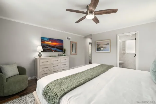 a view of a hallway with a white walls and wooden floor