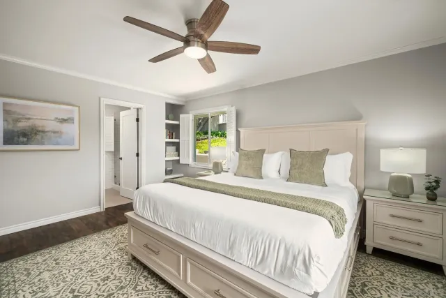 a bedroom with a bed and a dresser