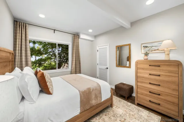 an aerial view of multiple houses with a yard