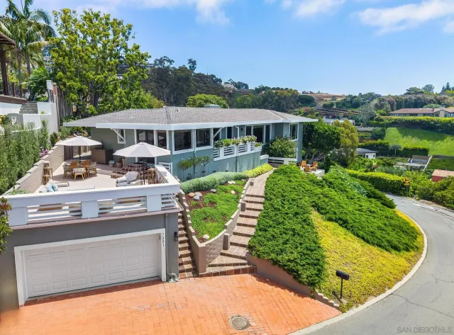 a living room with fireplace furniture and a flat screen tv