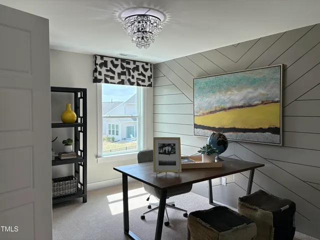 a view of a workspace with furniture