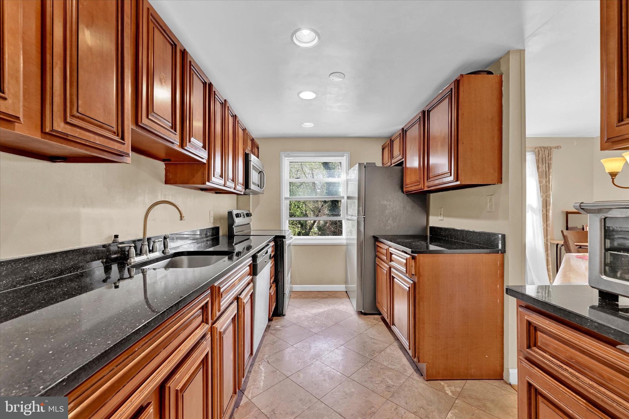 6402 Falkirk Road Baltimore, MD 21239 - Photo 7 of 28 Solid wood cabinets and granite counters