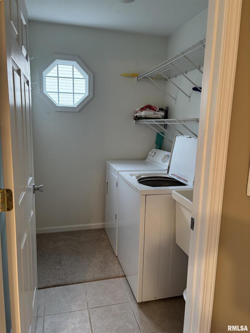 4232 Woodglen Lane Mount Vernon, IL 62864 - Photo 18 of 40 a utility room with cabinets washer and dryer