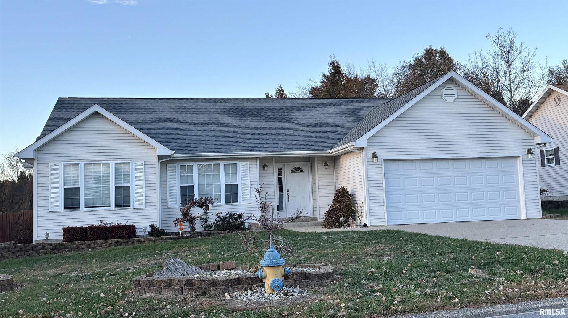 4232 Woodglen Lane Mount Vernon, IL 62864 - Photo 2 of 40 a front view of house with yard and outdoor seating