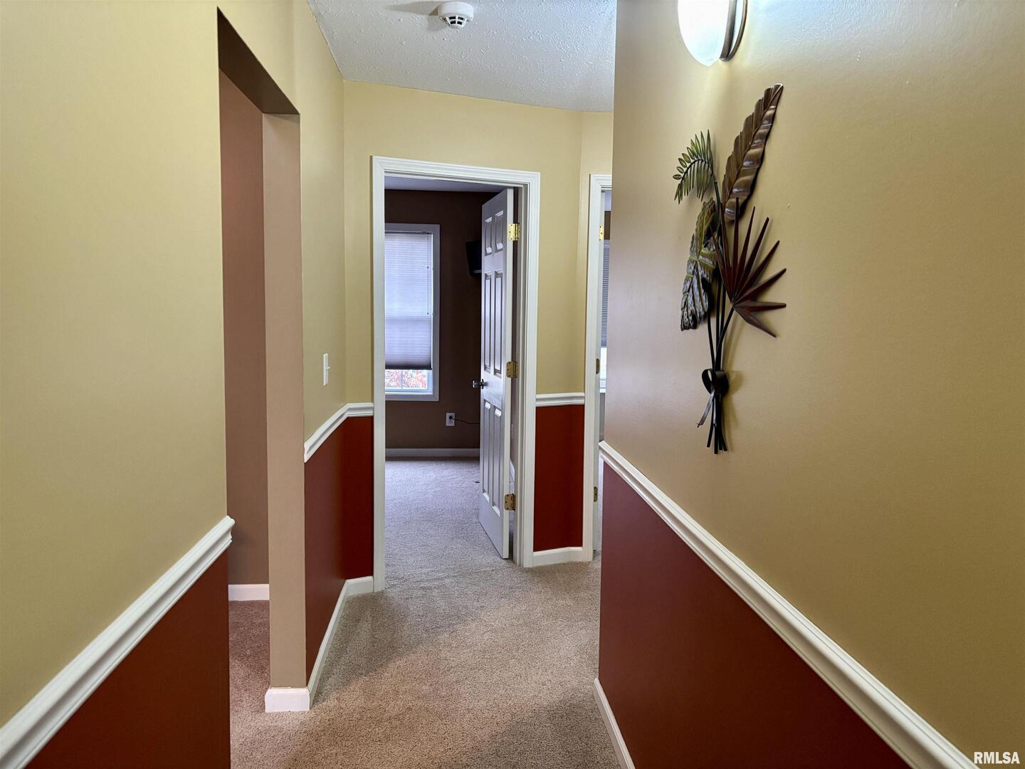 4232 Woodglen Lane Mount Vernon, IL 62864 - Photo 27 of 40 a view of hallway with bathroom and wooden floor