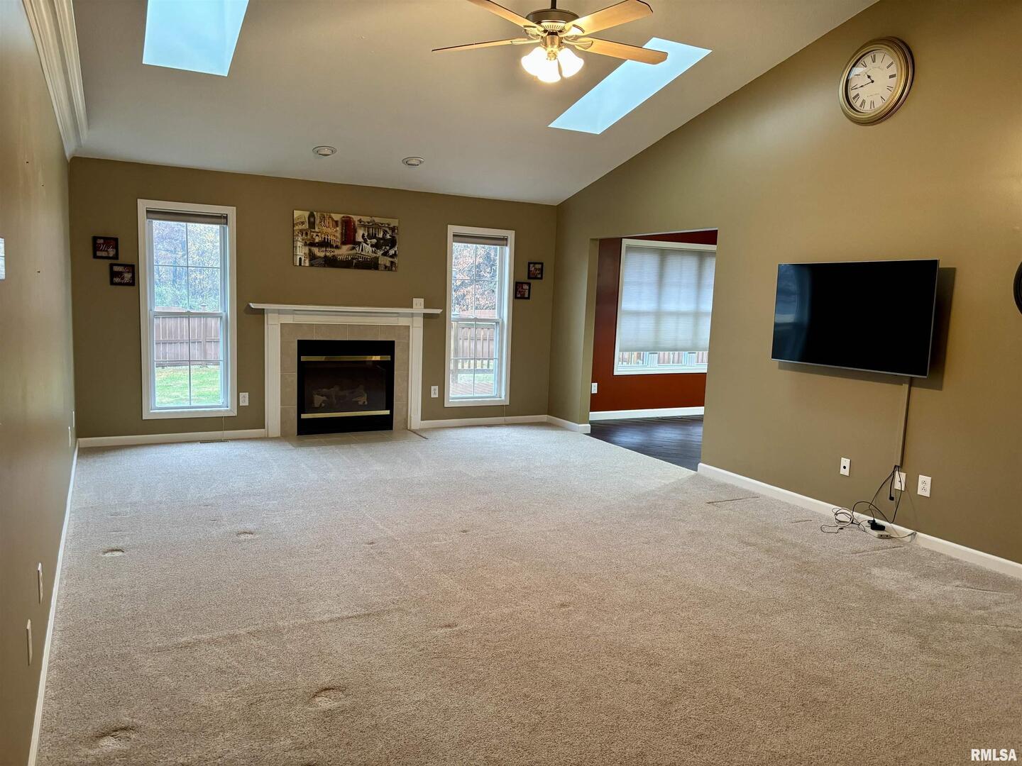4232 Woodglen Lane Mount Vernon, IL 62864 - Photo 4 of 40 a view of livingroom with furniture fireplace and a flat screen tv