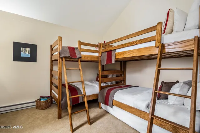 a bedroom with a bed and a chair