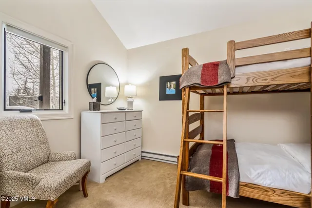 a bed room with a bed and a window