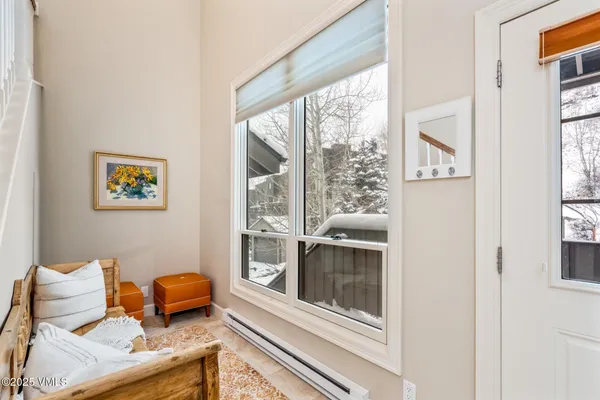 a view of a patio with table and chairs and wooden floor