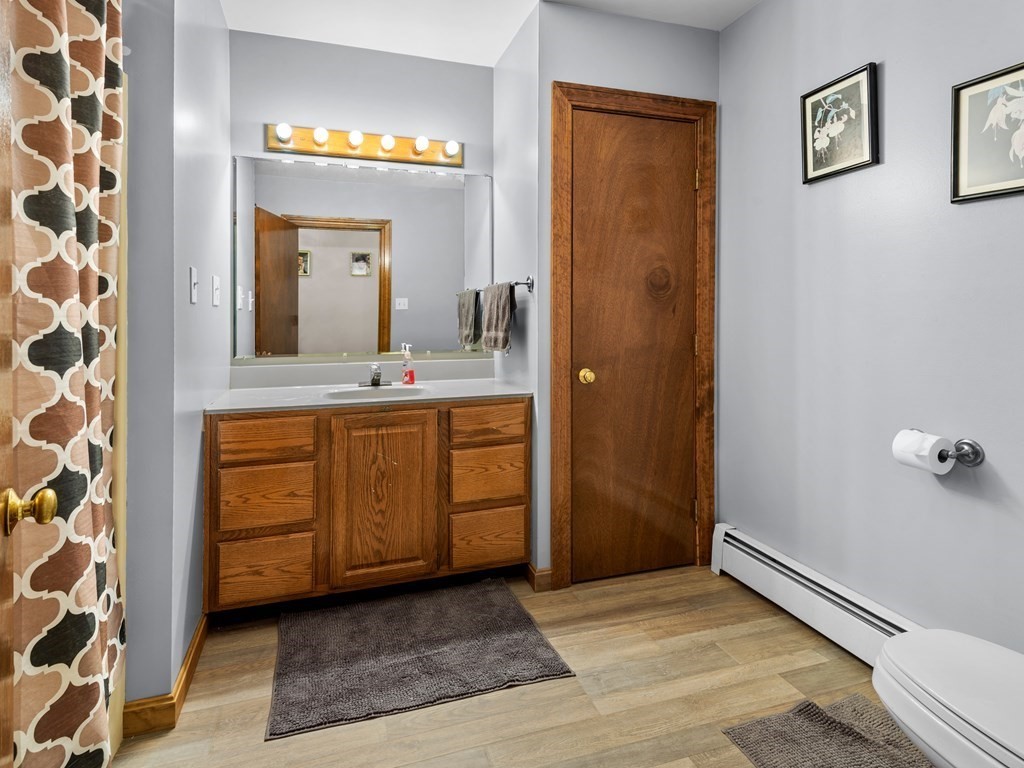18 Gray Road Templeton, MA 01468 - Photo 11 of 38 a bathroom with a sink a mirror and a shower