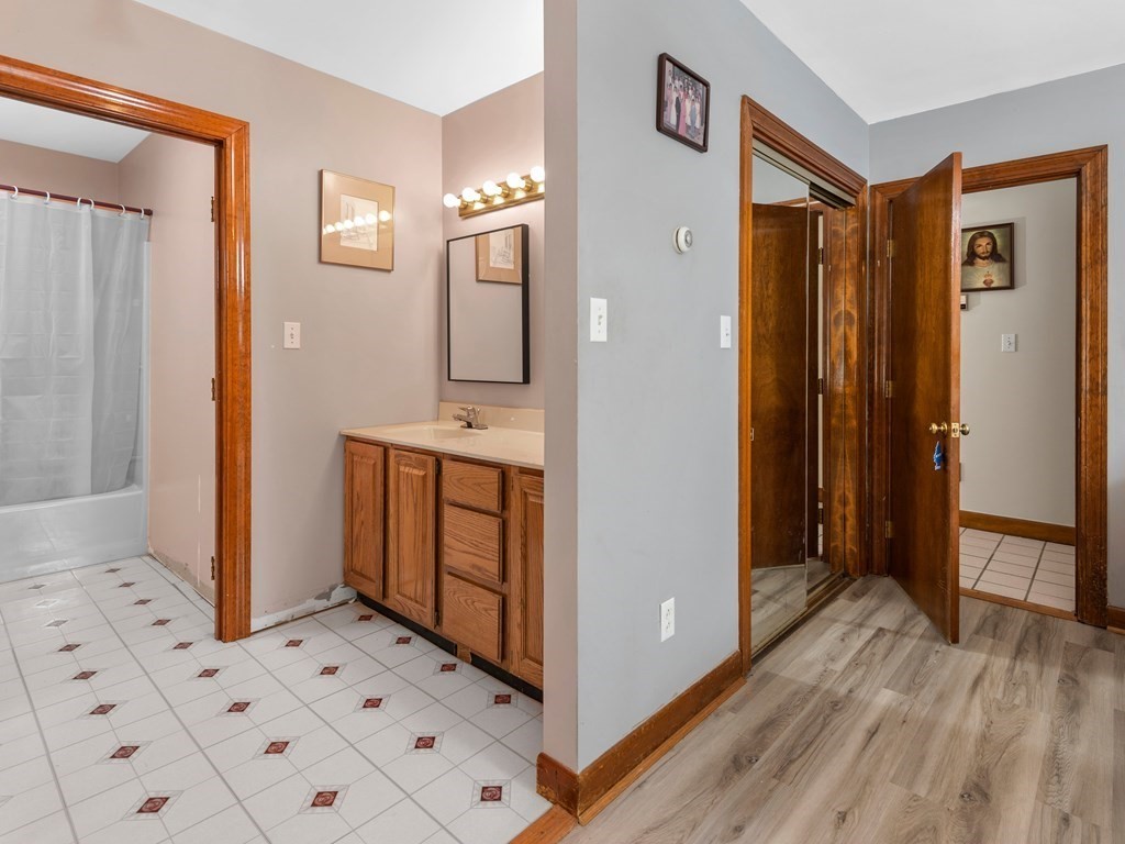 18 Gray Road Templeton, MA 01468 - Photo 17 of 38 a view of a hallway with bathroom and wooden floor