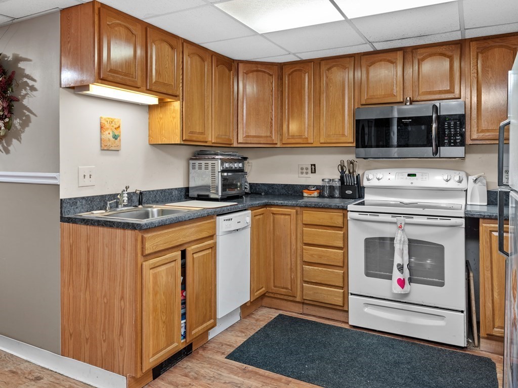 18 Gray Road Templeton, MA 01468 - Photo 26 of 38 a kitchen with stainless steel appliances granite countertop a stove a sink and a microwave