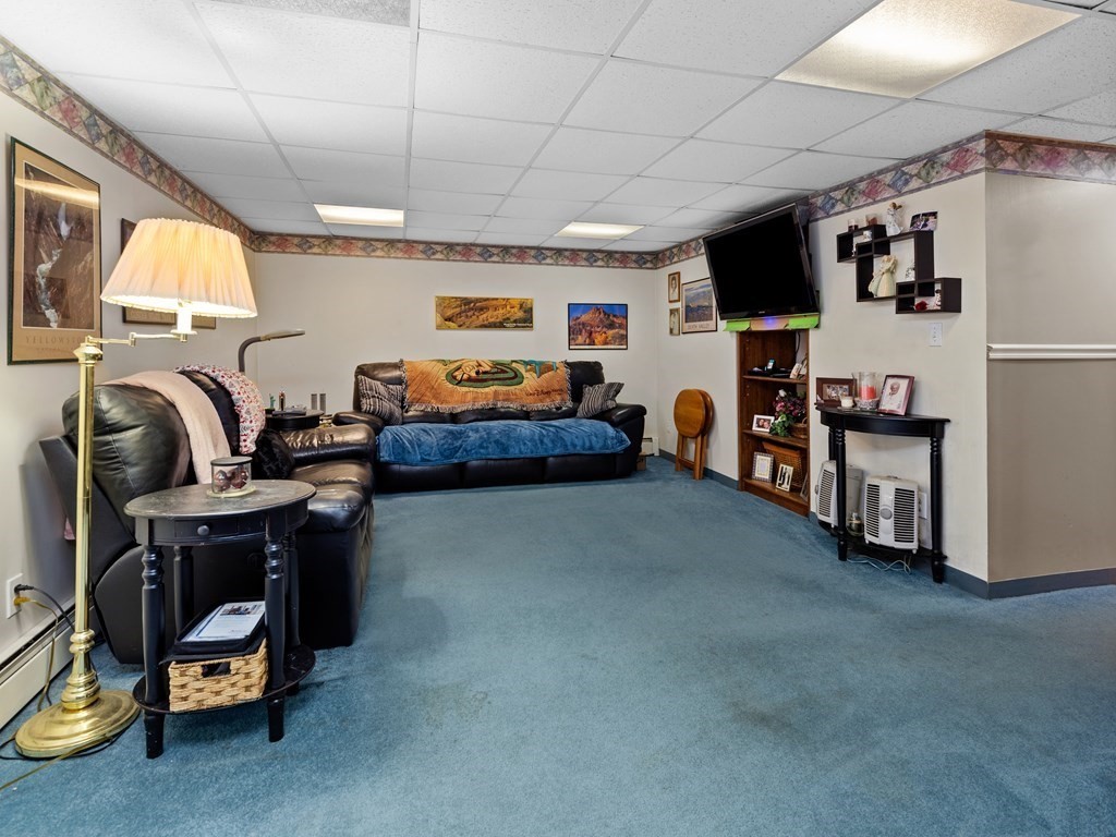 18 Gray Road Templeton, MA 01468 - Photo 28 of 38 a bedroom with furniture and a flat screen tv