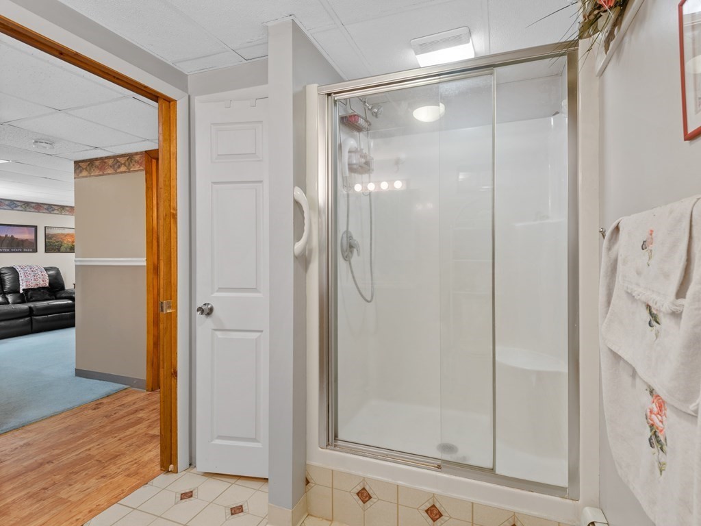 18 Gray Road Templeton, MA 01468 - Photo 33 of 38 a bathroom with a glass shower door and a sink