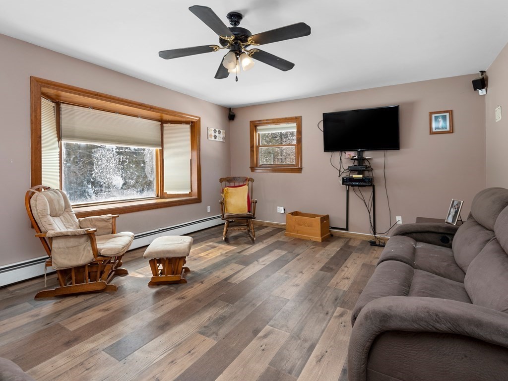 18 Gray Road Templeton, MA 01468 - Photo 4 of 38 a living room with furniture and a flat screen tv