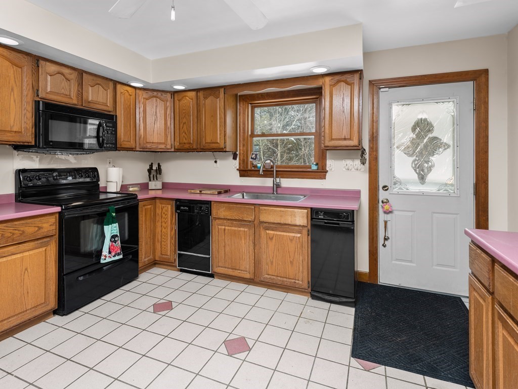 18 Gray Road Templeton, MA 01468 - Photo 6 of 38 a kitchen with stainless steel appliances granite countertop a stove a sink dishwasher and a microwave oven with cabinets