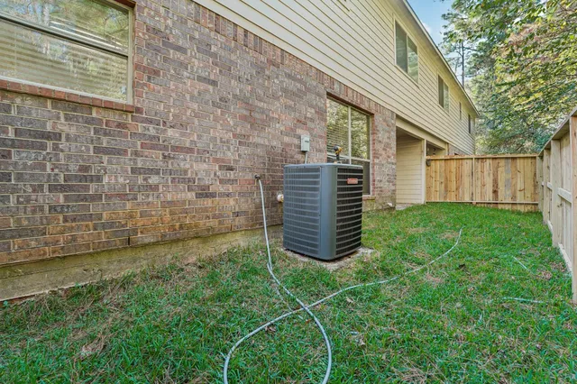 a view of house with backyard and garden