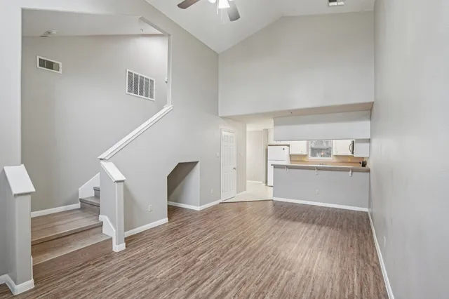 a view of a kitchen cabinets and wooden floor
