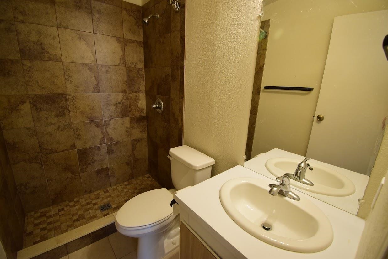 19548 B50 Road Delta, CO 81416 - Photo 21 of 37 a bathroom with a sink toilet and a mirror