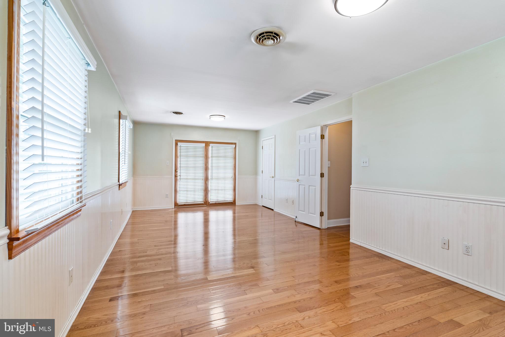 7 Weed Lane Elkton, MD 21921 - Photo 14 of 34 a view of an empty room with wooden floor and a window