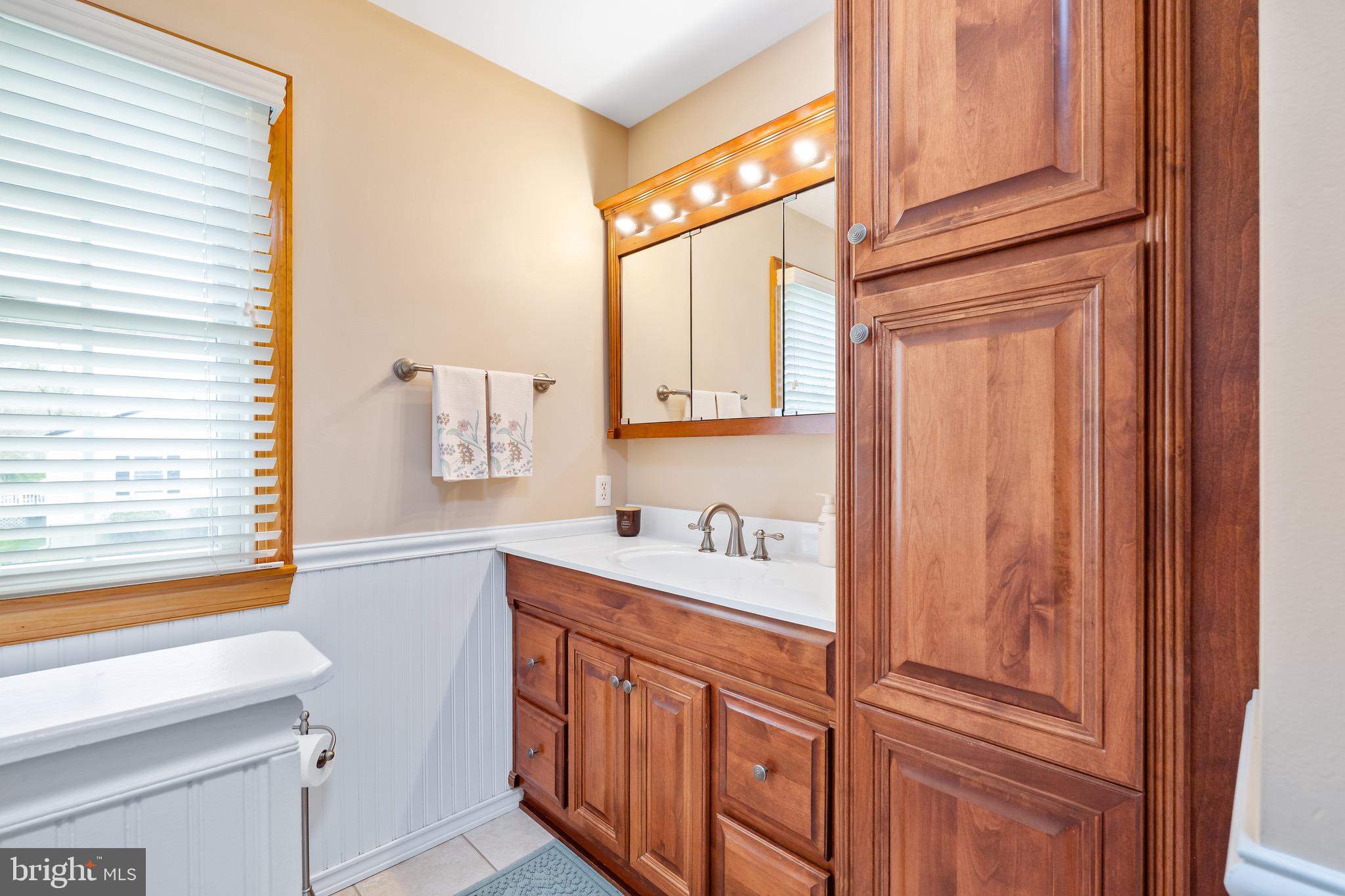 7 Weed Lane Elkton, MD 21921 - Photo 21 of 34 a bathroom with a sink a vanity and a mirror
