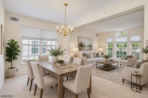 a view of a dining room with furniture window and outside view