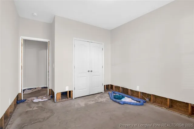 an empty room with air conditioner and closet