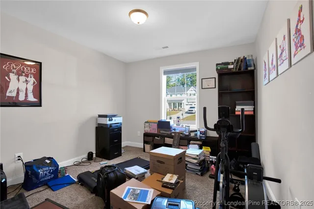 a room with furniture a flat screen tv and a window