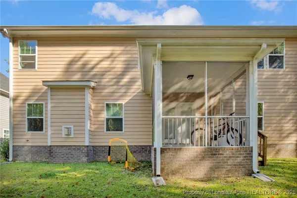 a view of house with yard