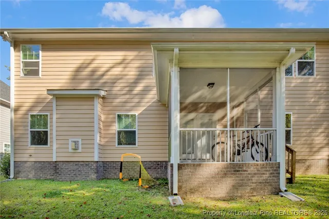 a view of house with yard