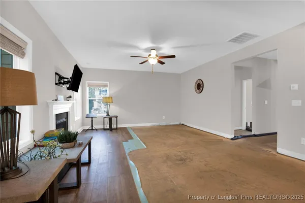 a view of livingroom and hardwood floor