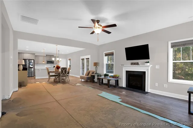 a view of a livingroom with furniture and a fireplace