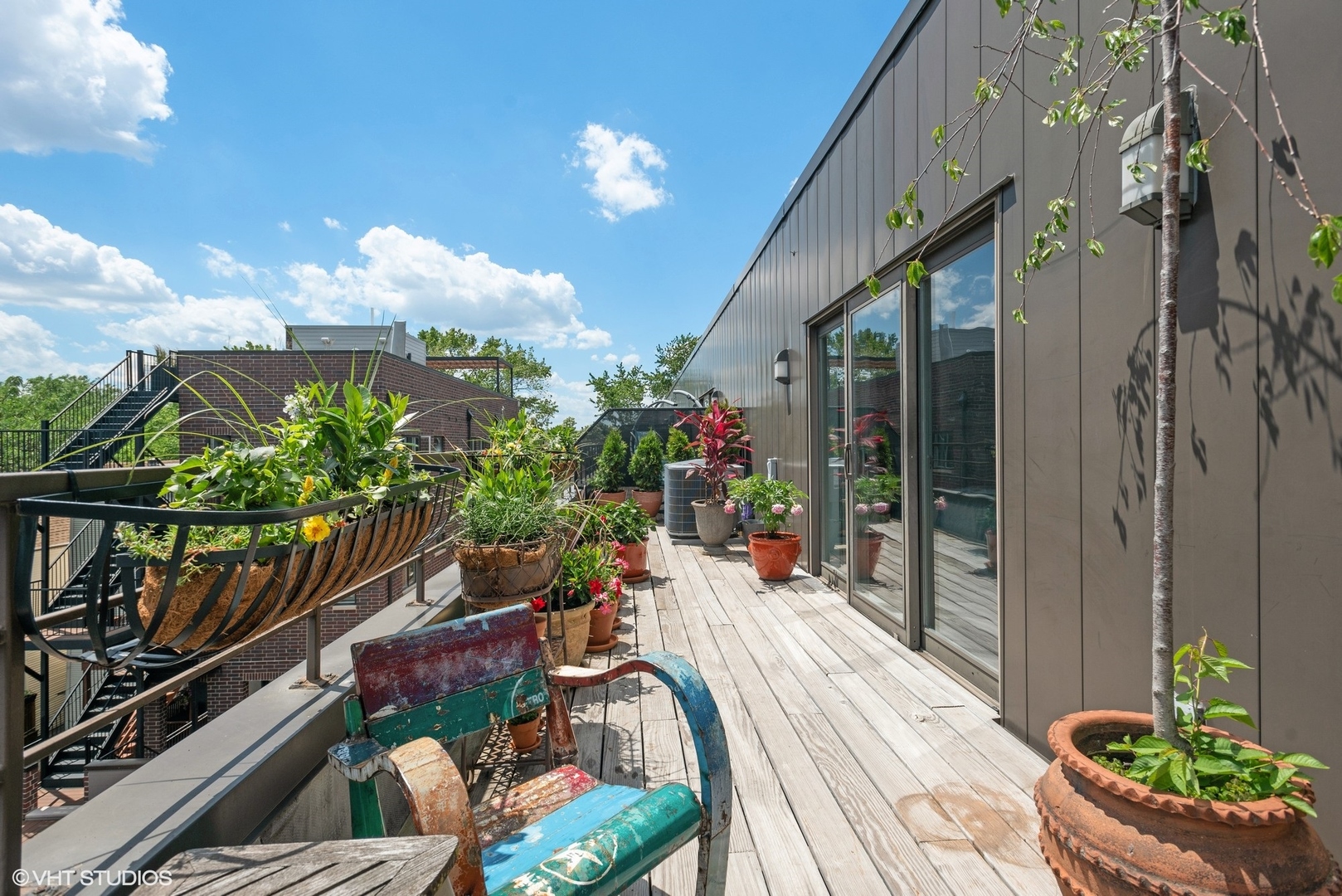 2751 North Greenview Avenue, Unit F Chicago, IL 60614 - Photo 12 of 29 a view of a balcony with chairs potted plants