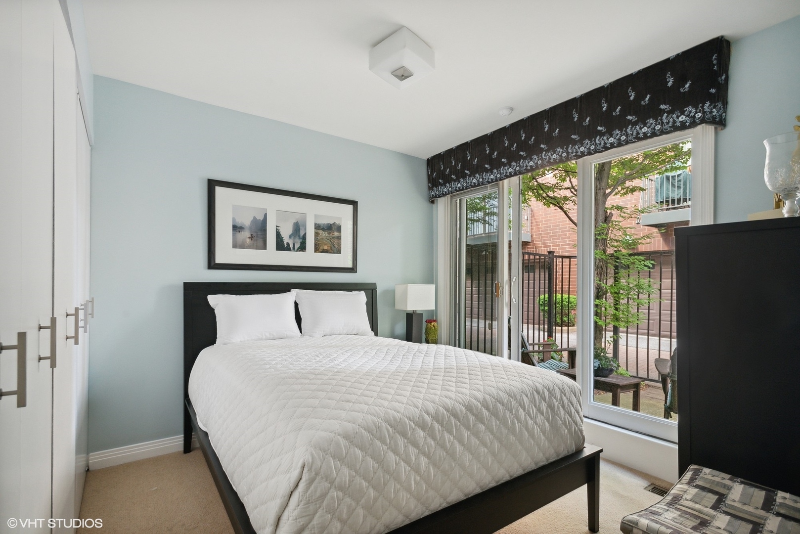 2751 North Greenview Avenue, Unit F Chicago, IL 60614 - Photo 24 of 29 a bedroom with a bed and a large window