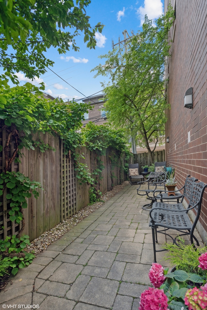 2751 North Greenview Avenue, Unit F Chicago, IL 60614 - Photo 28 of 29 a patio with table and chairs and potted plants