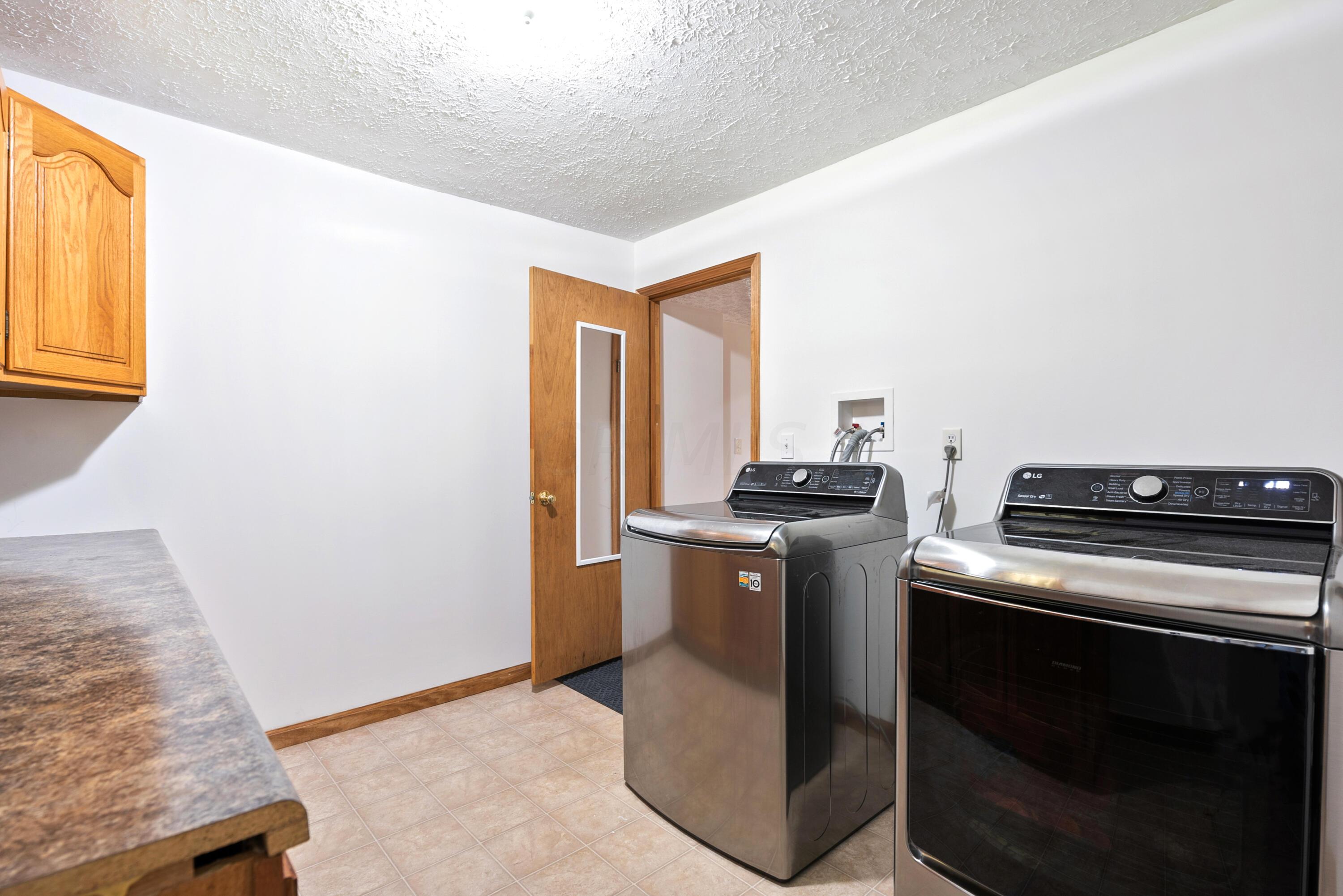 13078 Cleveland Road Southwest Pataskala, OH 43062 - Photo 9 of 25 1st floor laundry