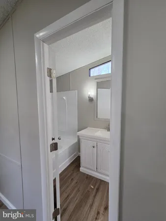 a bathroom with a double vanity sink a and a mirror