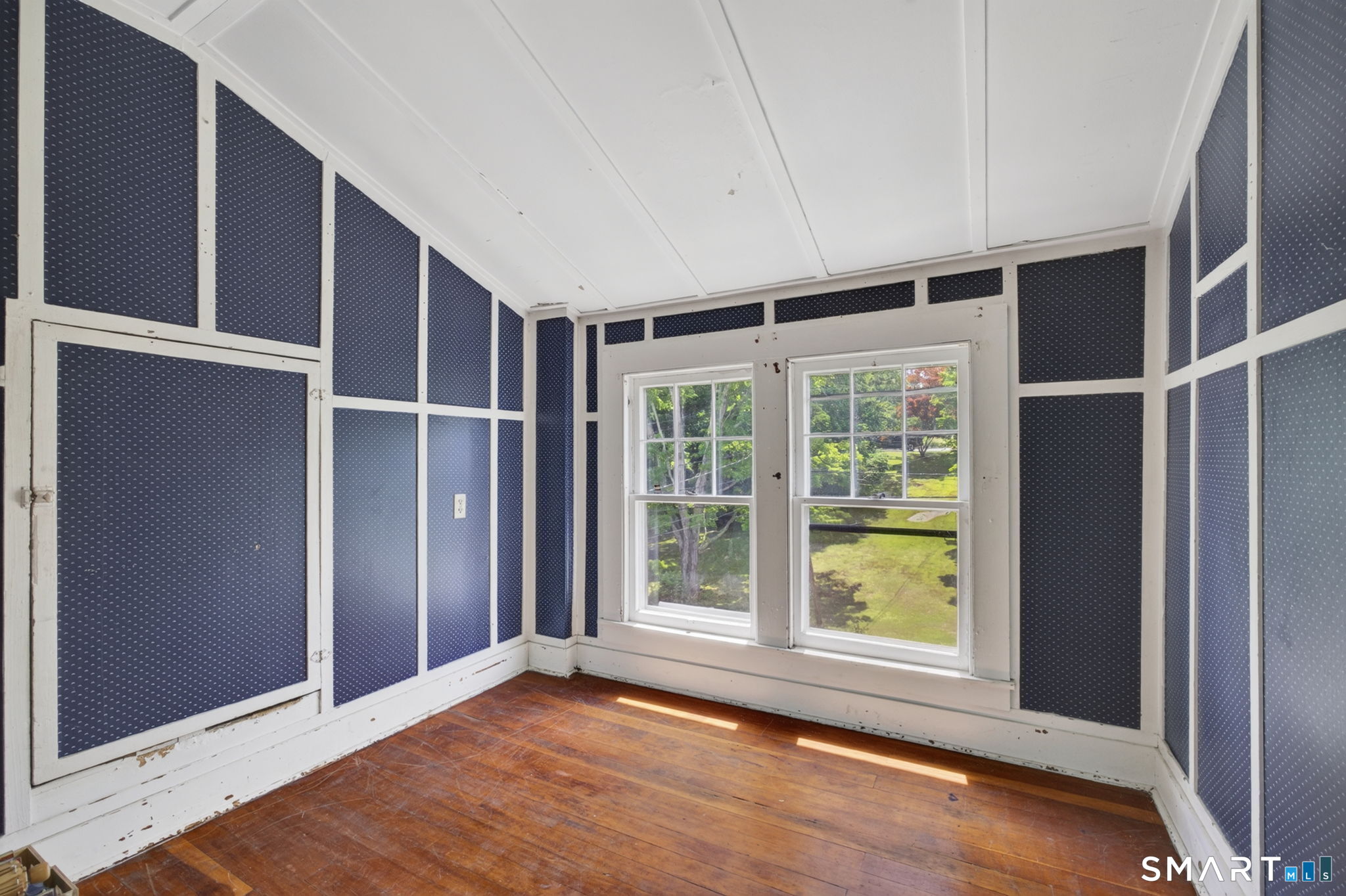 79 River Street Deep River, CT 06417 - Photo 27 of 40 a view of an empty room with wooden floor and a window