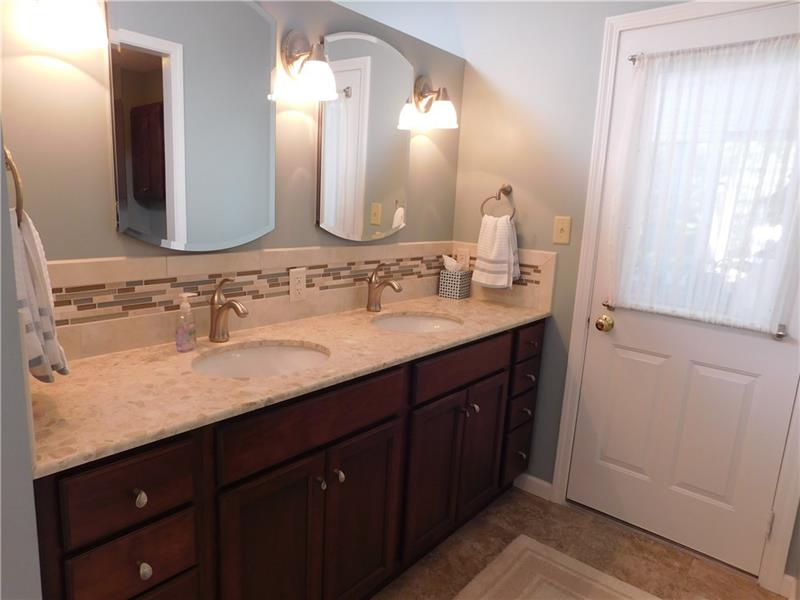 935 Ruth Street Pittsburgh, PA 15243 - Photo 12 of 25 The coveted double sinks still with plenty of counter space for hairdryers and curling irons. The mirrors open up in a perfect angle to enable a view of the back of your hair! The door leads to a greenhouse!