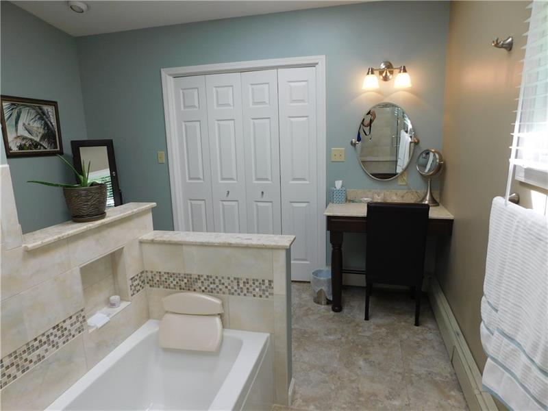 935 Ruth Street Pittsburgh, PA 15243 - Photo 13 of 25 Stay a while in the tub soaking the day's stress away! What a wonderful vanity area.