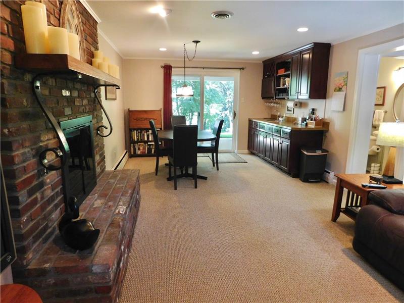 935 Ruth Street Pittsburgh, PA 15243 - Photo 20 of 25 This is where you will live and entertain. The raised hearth brick fireplace is wood burning and has a newer steel chimney liner. The wet bar is a perfect addition. The sliding glass door lead to the covered porch.