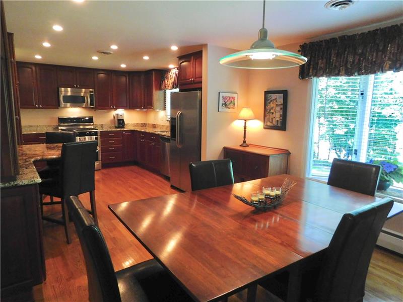 935 Ruth Street Pittsburgh, PA 15243 - Photo 6 of 25 Stunning kitchen with gorgeous granite and stainless appliances. There is even a drop down cookbook holder that keeps your cookbook clean and out of the way.
