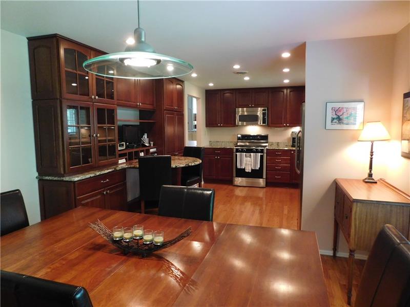 935 Ruth Street Pittsburgh, PA 15243 - Photo 7 of 25 Multi-use area is your eat-in dining area, desk, tv, pantry, and storage space. What a versatile arrangement!