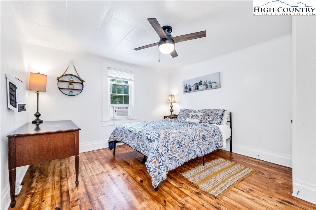609 West Main Street Jefferson, NC 28640 - Photo 28 of 42 a bedroom with a bed and window