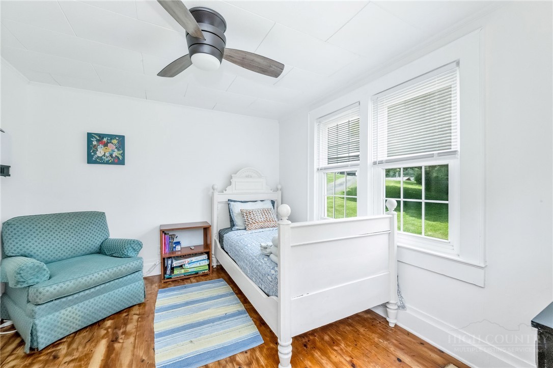 609 West Main Street Jefferson, NC 28640 - Photo 37 of 42 a bed room with a bed and a couch