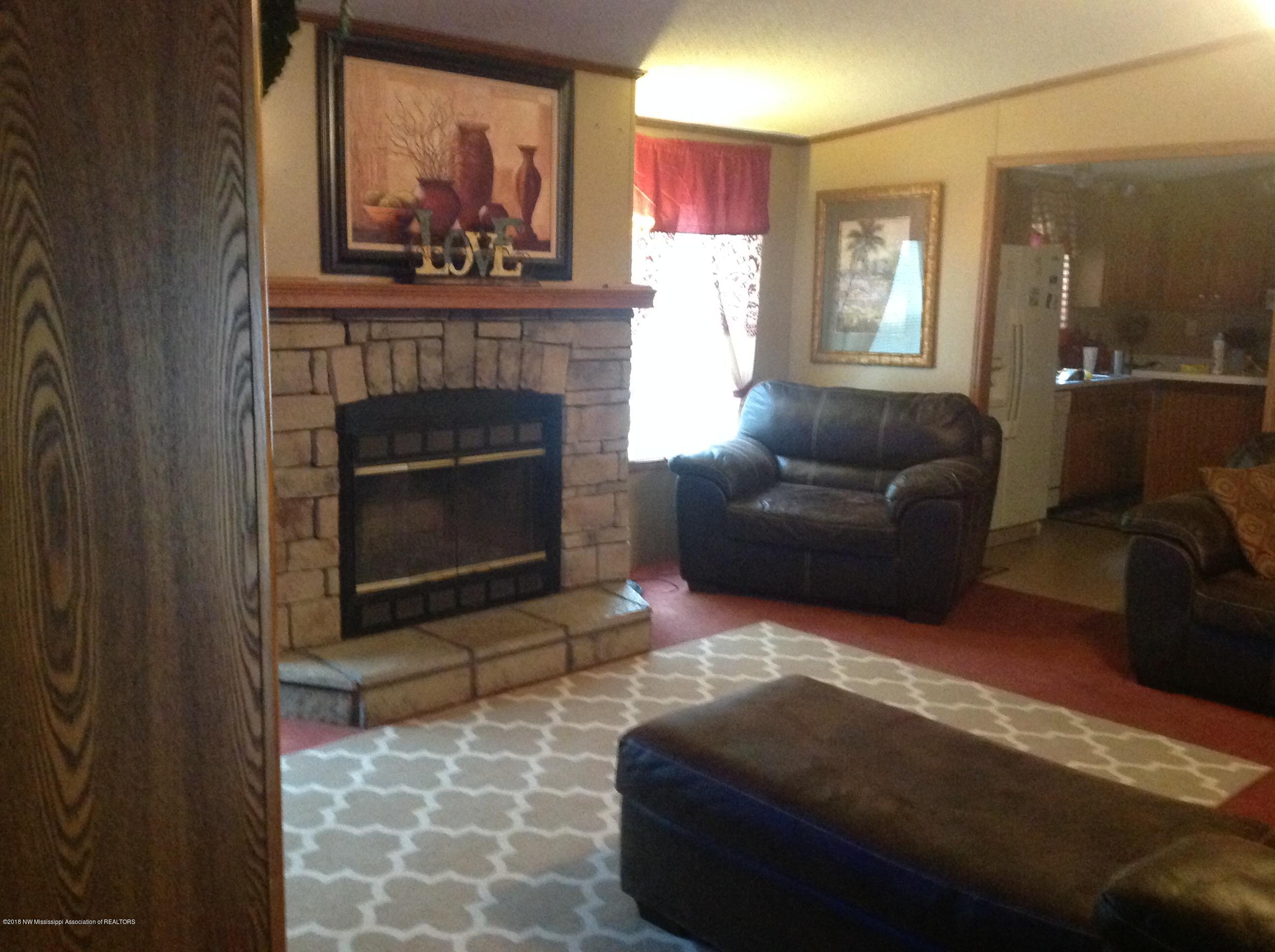 1677 Lyles Road Senatobia, MS 38668 - Photo 2 of 13 Living Room with Stone fireplace