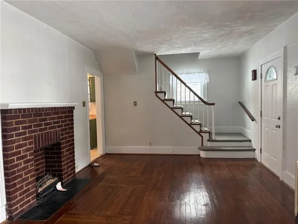 a view of entryway with wooden floor