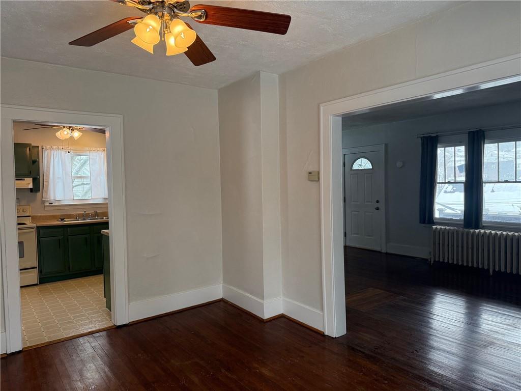 5708 Pontiac Drive Export, PA 15632 - Photo 10 of 29 a view of an empty room with wooden floor and a window