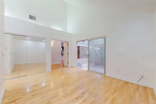 a spacious bathroom with a sink and a mirror