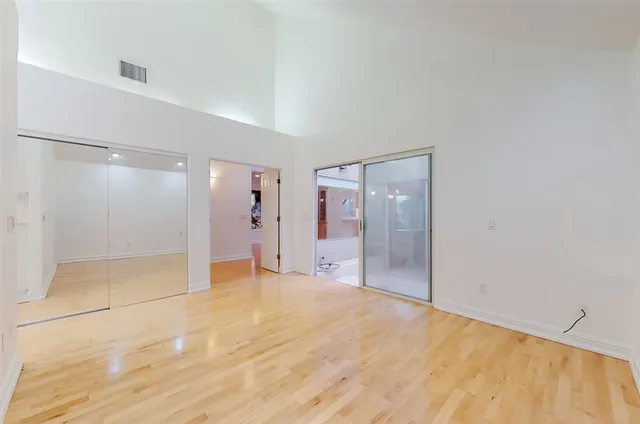 a spacious bathroom with a sink and a mirror
